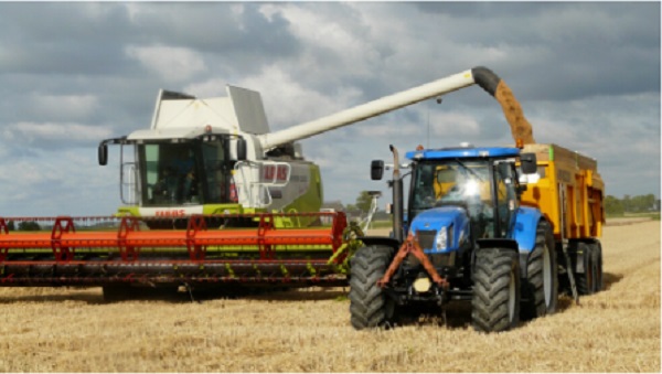 A picture of a combine harvester, tractor and other agriculture machines