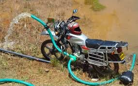 Pumping water using a motorbike-powered water pump