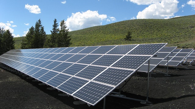 solar farm of panels set up in a country side