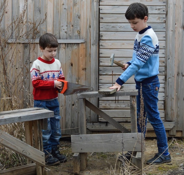 boys working with carpenter tools