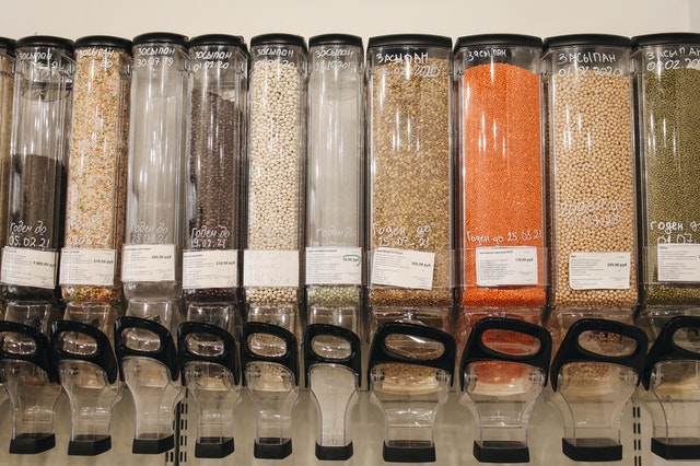 Wall mounted clear cereal dispensers  in a self service cereals business store