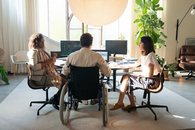 a-group-of-people-having-a-meeting-in-the-office