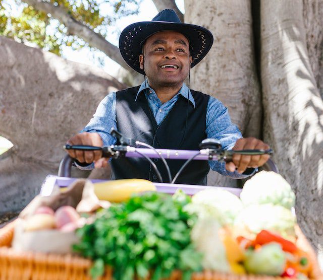 a-smiling-man-selling-organic-vegetables