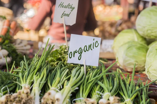 Organic foods. Fresh organic food at the local farmers market. Farmers markets are a traditional way of selling agricultural products. 